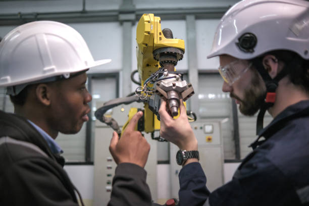 istock Multiracial tachnicial engineer training with robot arm 1622332881