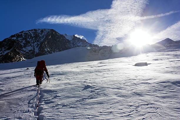 istock climbers on rope with glacier - sunny day 162233544