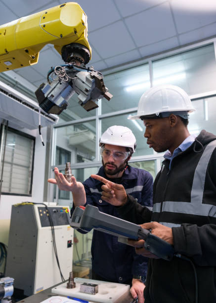 istock Multiracial tachnicial engineer training with robot arm 1622336692