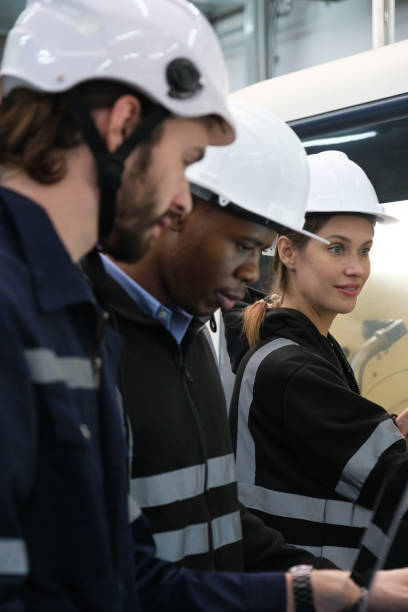 istock Multiracial tachnicial engineer training with robot arm 1622343592
