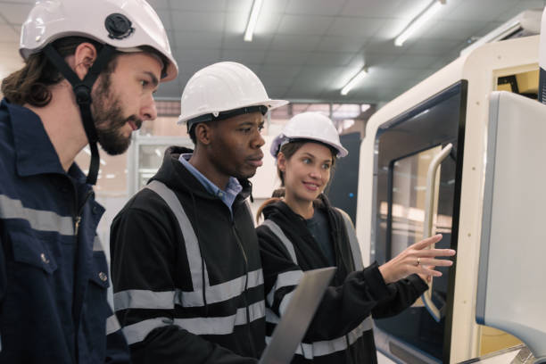 istock Multiracial tachnicial engineer training with robot arm 1622344669