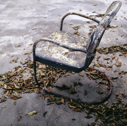 Abandoned chair in the garden
