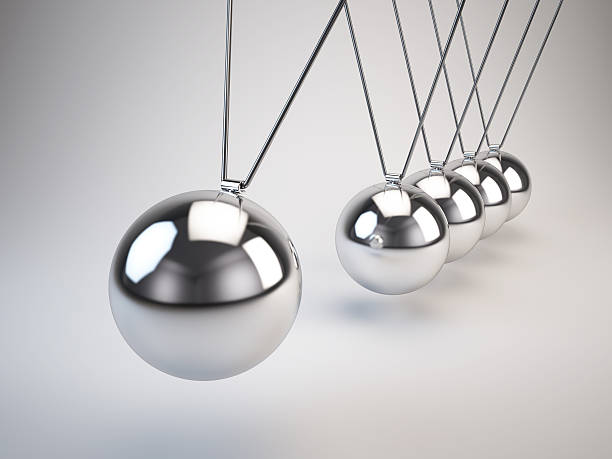 istock Newton's cradle of balancing balls swinging side to side 162235451
