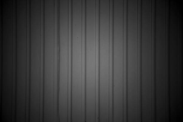 istock Soft Light Vignette On Dark Metal Sheet Wall 1622358789