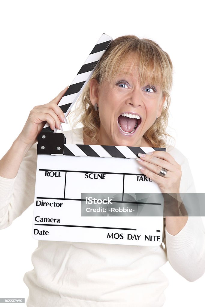 Donna che tiene un film ardesia - Foto stock royalty-free di Adulto