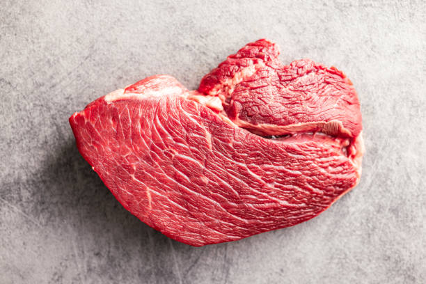 istock Raw fillet steak beef meat on kitchen table. 1622380889