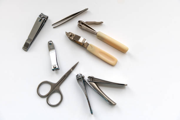 Nail clippers and scissor isolated in white.