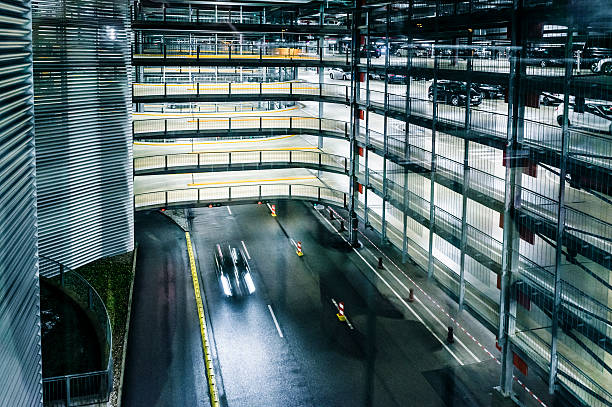 istock Multi-level covered parking garage with parking lofts, at night 162238967