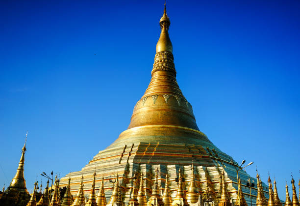 This giant golden temple is said to date back 2500 years and house some relics of the Buddha including his hair.(People Are Unrecognizable Due To Motion Blur, Done In Camera Not Through Editing)