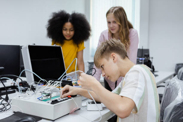 istock Boy learning to repair electrical appliances. education on table at class room, Robotics learning innovation. electric system skill training. STEM education concept. 1622409121