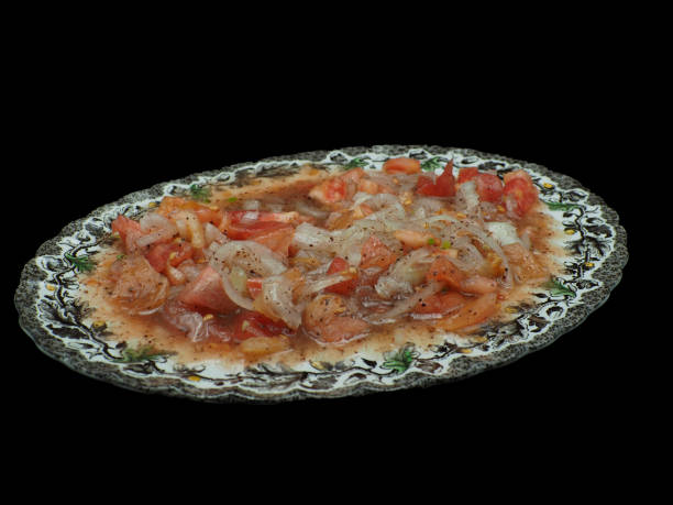 istock Turkish shepherd salad on a porcelain plate. Black background 1622419932