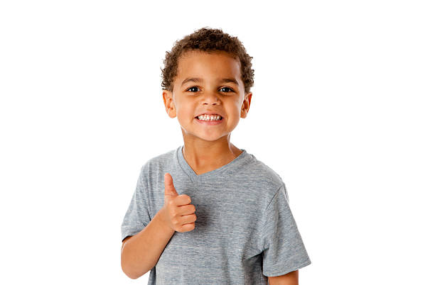 istock Smiling Mixed Race Little Boy Thumbs Up Approval 162242095