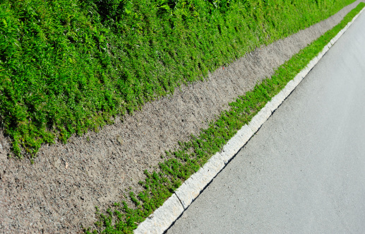 Gravel path along an asphalt road