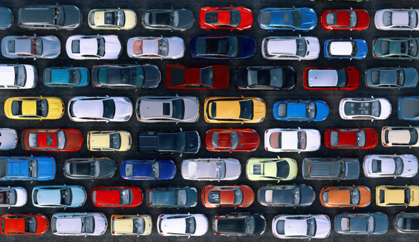 A traffic jam during rush hour, vehicles lined up in rows, top view. A traffic jam during rush hour, vehicles lined up in rows, top view. Cars are stuck in traffic on multiple lane city highway causing congestion, transport pollution problems in town. Transportation 3D automobile industry stock pictures, royalty-free photos & images