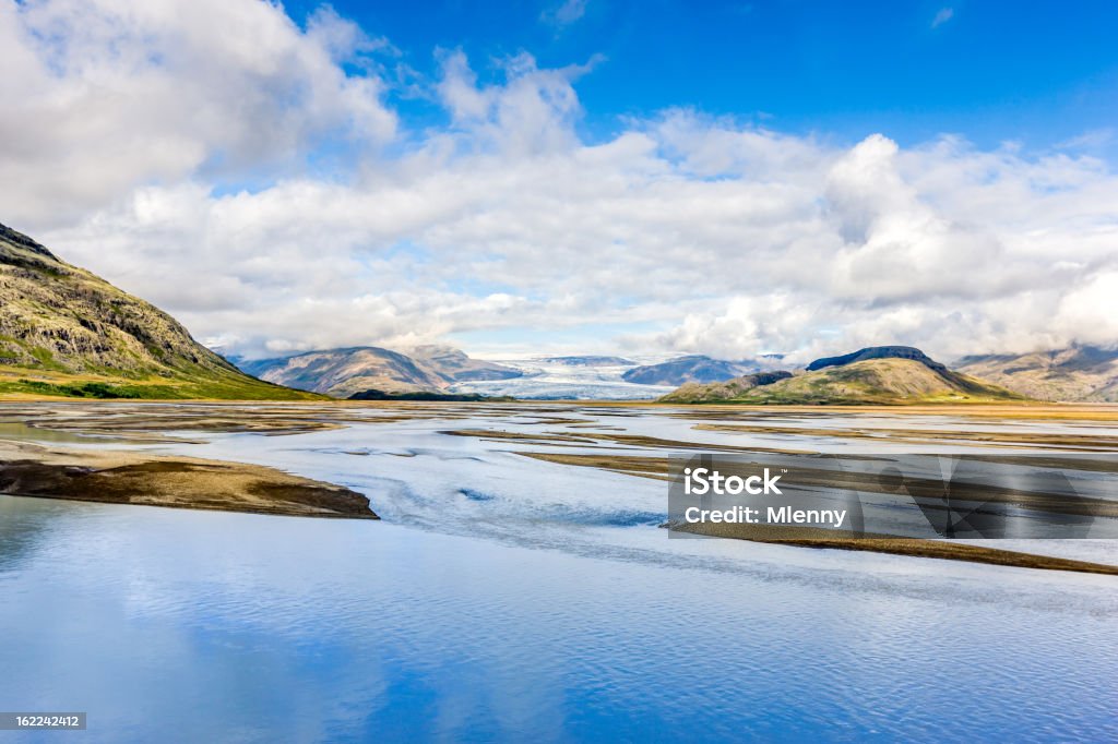 Icelandic South Central Coast, Iceland Beautiful icelandic landscape in summer under blue sky. Clear water streams from the glaciers on the horizon floating towards the atlantic ocean, South Central Coast, Iceland Atlantic Ocean Stock Photo
