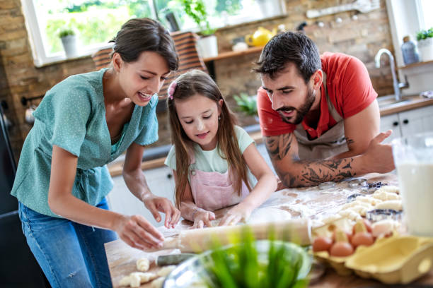 istock Happy family make cookies 1622425644