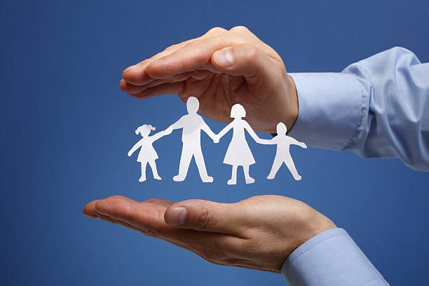 istock Paper chain family protected in cupped hands 162242585