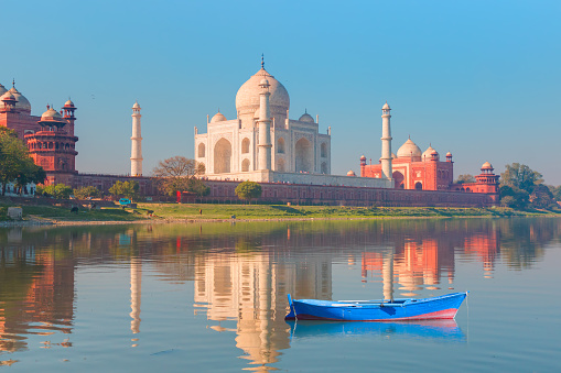 Taj Mahal monument reflecting in water of the river, Agra, India