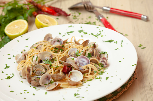 Spaghetti alle vongole in bianco, pasta with clams,served on plate