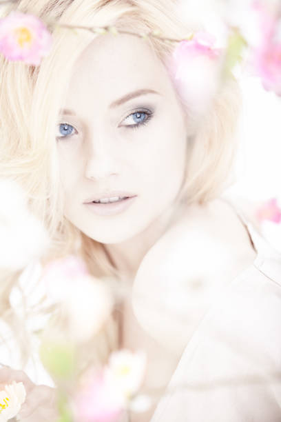 istock beautiful woman with spring flowers 162247006