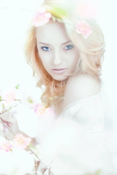 istock beautiful woman with spring flowers 162247013