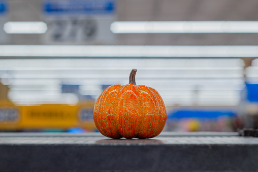 Plastic pumpkin. Sale of decorative objects of autumn season.