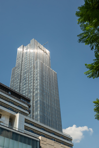Chengdu, Sichuan province, China - Aug 13, 2023 : Oppo tower against blue sky.