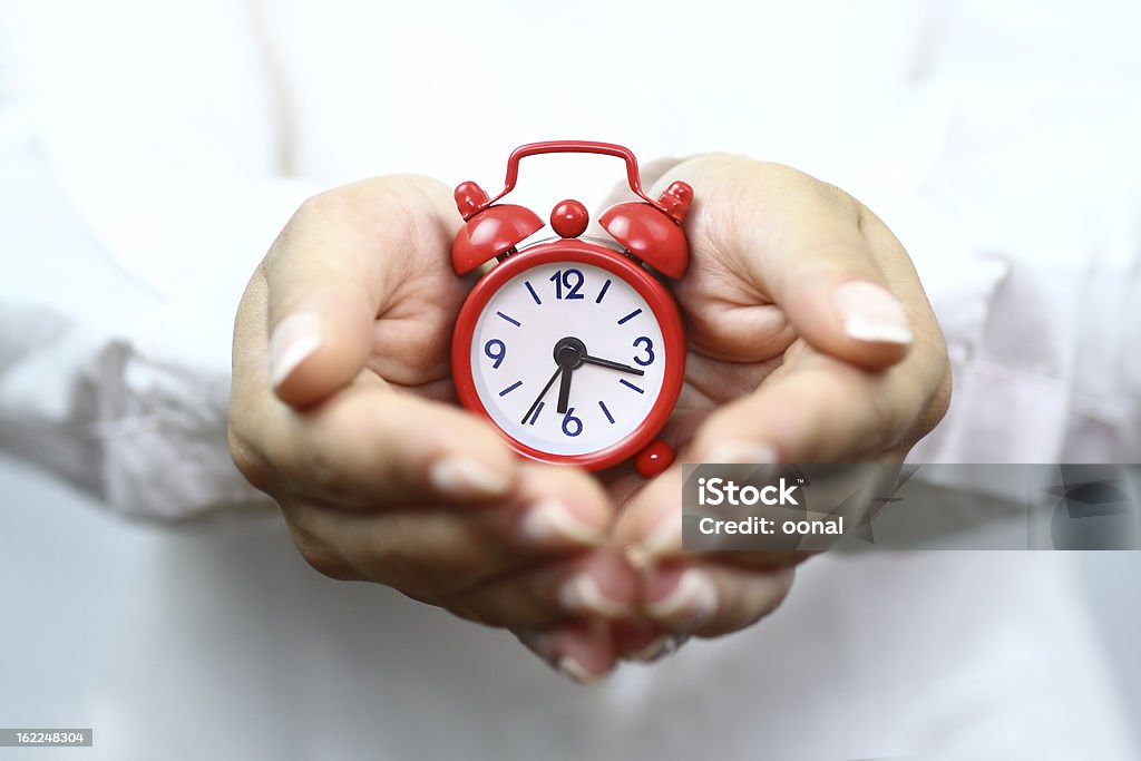 Showing red alarm clock Time Stock Photo