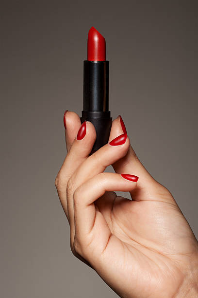istock Woman Hand Holding Red Lipstick 162248459