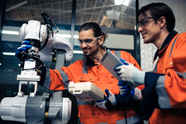 istock Multiracial tachnicial engineer training with robot arm 1622490292