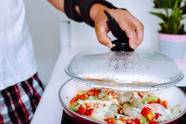istock Man with adjustable elbow brace preparing food 1622491364
