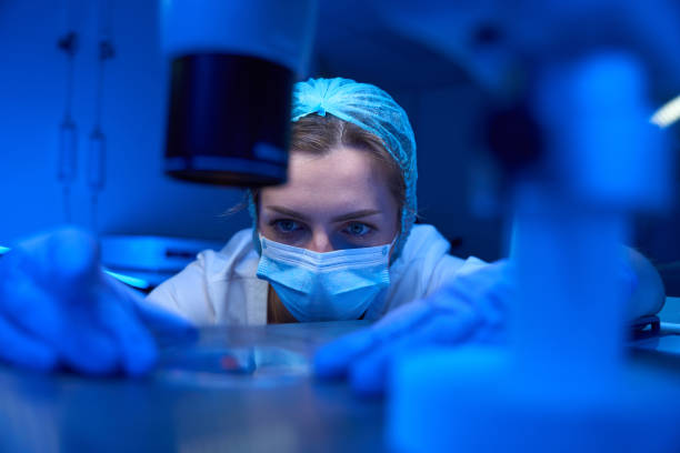 istock Young laboratory assistant works with biomaterial in a sterile laboratory 1622524232