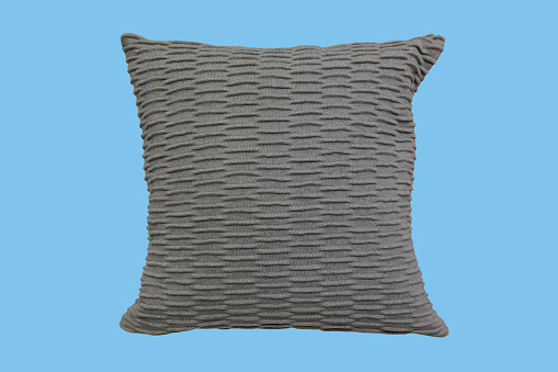 Decorative grey knitted couch corrugated cushion isolated on white background