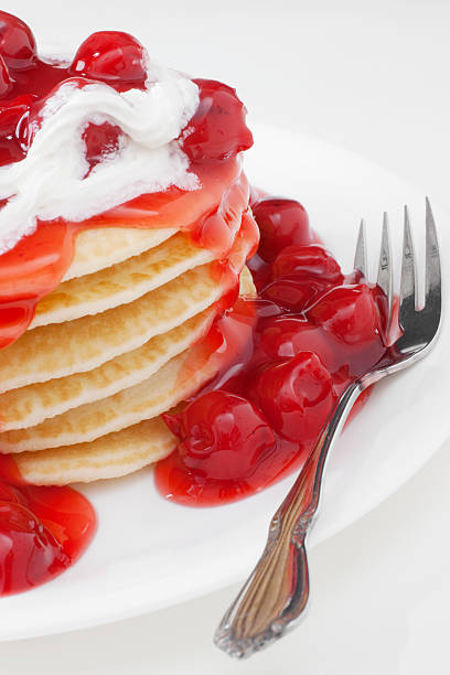 istock breakfast of pan cakes with cherry topping 162253087