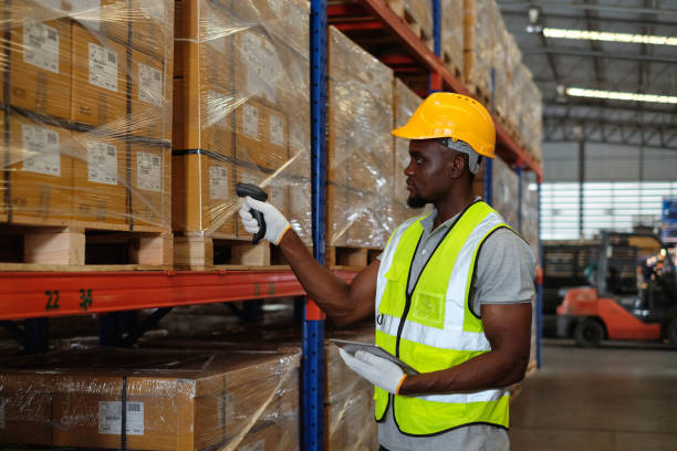 istock African american male worker factory using barcode scanner doing scan barcodes to count inventory in warehouse. 1622537467