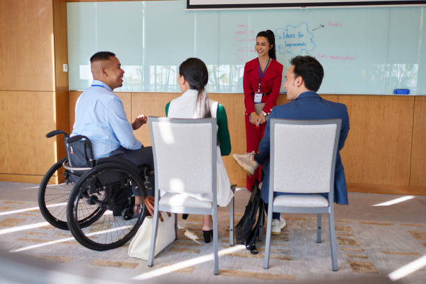 istock Brainstorming session between a diverse group of young business individuals, abled and disabled stock photo 1622539701
