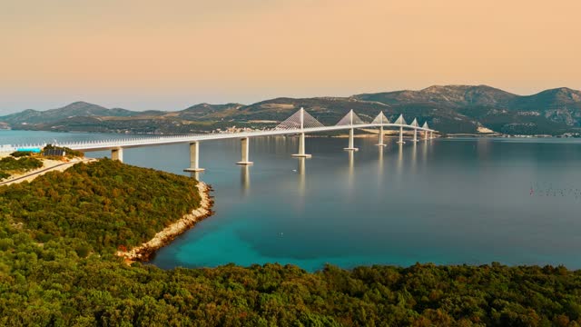 AERIAL VIEW of Peljesac bridge passing over Bay of Mali Ston in Croatia