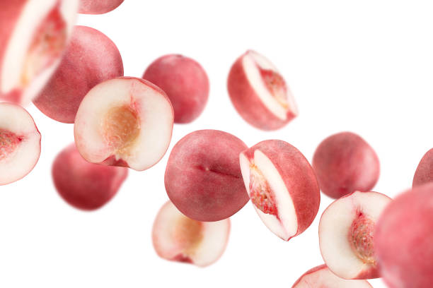 istock Levitation of pink peaches isolated on white background. 1622551140