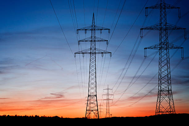 istock Silhouettes of electricity pylons at dusk 162255138