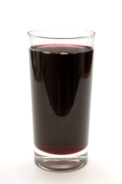 Glass of Red Grape Juice stock photo