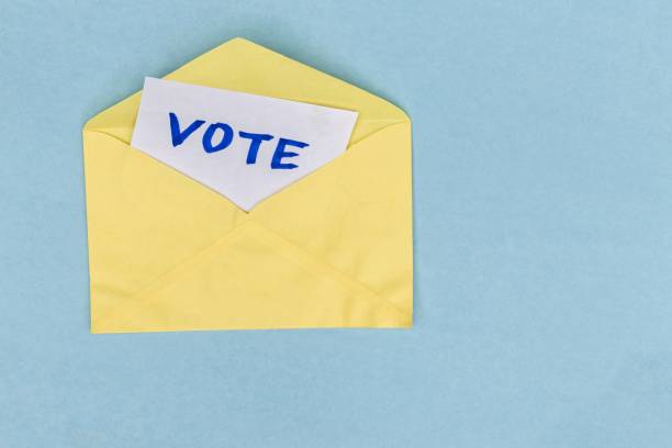 istock Vote Word Note in Envelope Isolated on Pink Background with Copy Space, Election or Voting Conceptual Photo 1622561557
