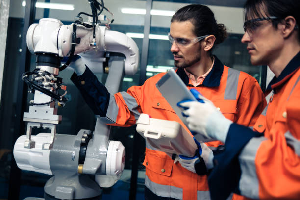 istock Multiracial tachnicial engineer training with robot arm 1622566943