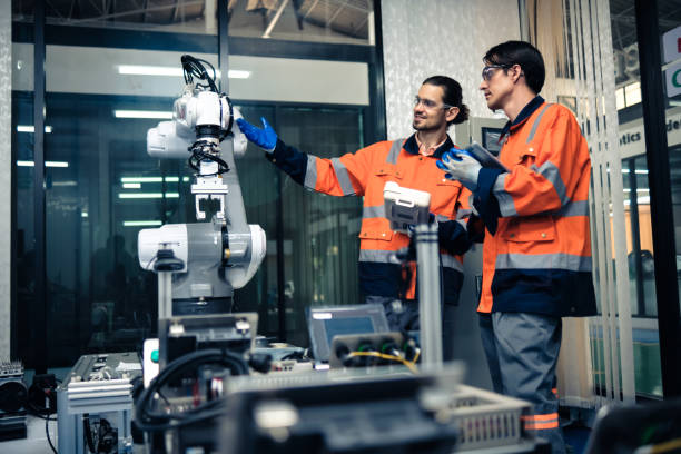istock Multiracial tachnicial engineer training with robot arm 1622571374