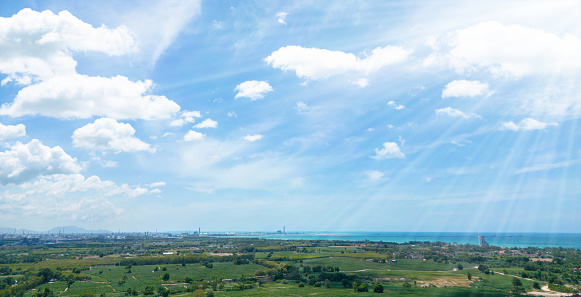 Sunny background, blue sky with white clouds and sun