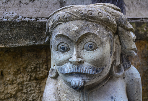 God statue at ancient temple in Bali, Indonesia.