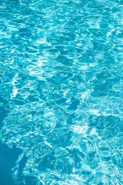 istock Blue ripped water in swimming pool, summer time 1622579976