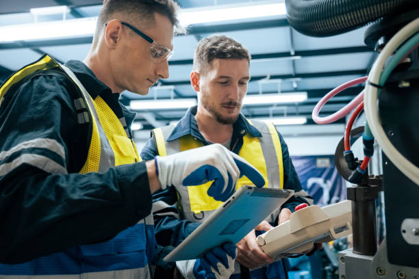 istock Multiracial tachnicial engineer training with robot arm 1622583256