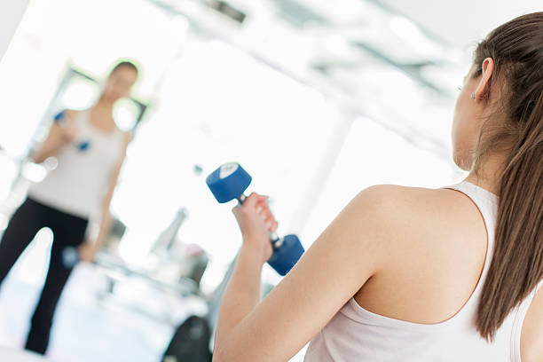 istock Young woman in the gym 162258708