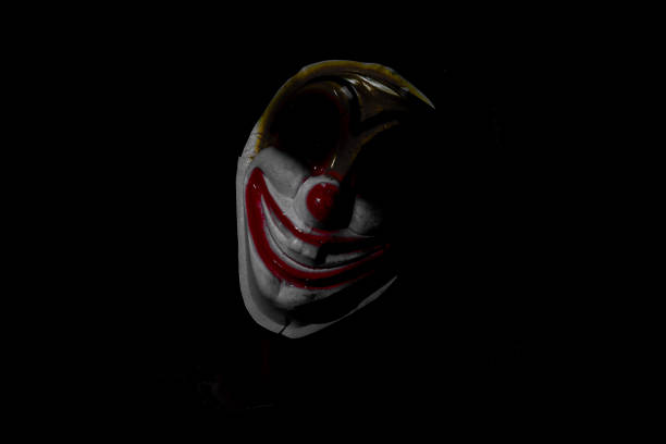 istock A creepy clown figure in the dark. 1622602170