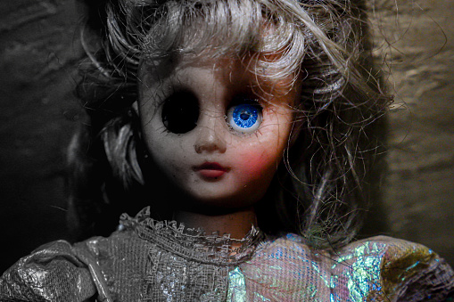 Female dolls with demon and human faces.
